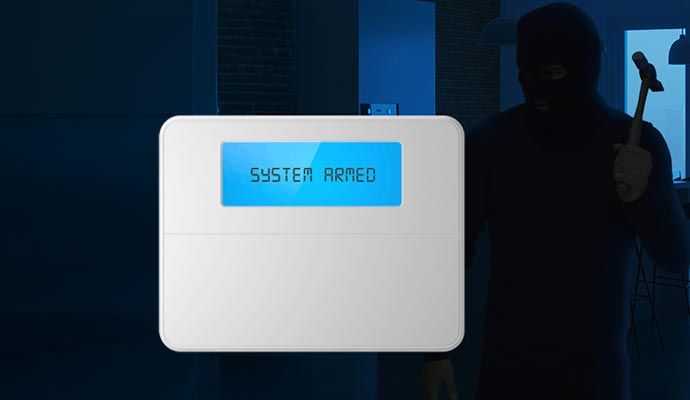 Burglary alarm system detecting a burglar in a commercial space