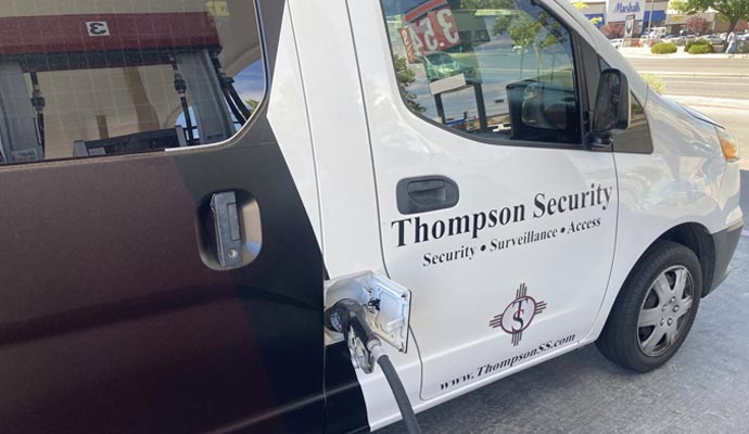 Thompson Security service van being refueled at a gas station