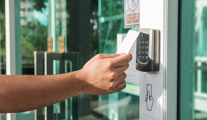 Key card on a wall-mounted access control reader