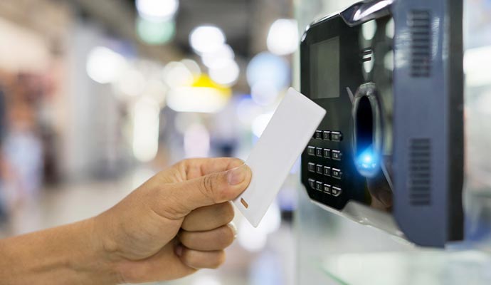 A person using a key card access control system