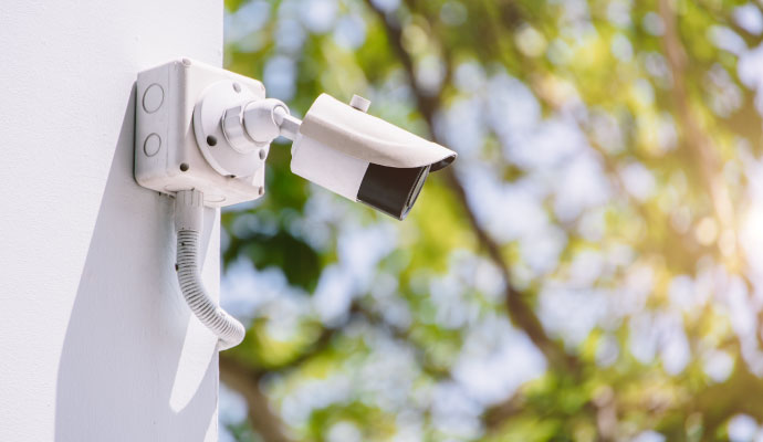 Outdoor bullet security camera installed on building wall