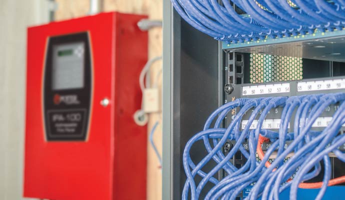 Potter ipa 100 fire panel beside server rack