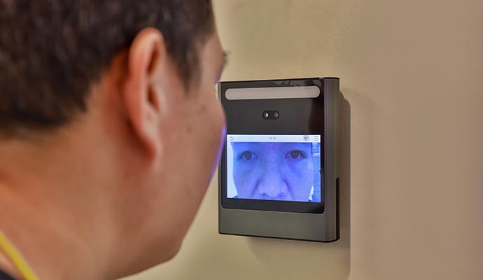 A person is using a retina scanner