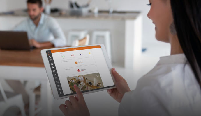 Person using home security app