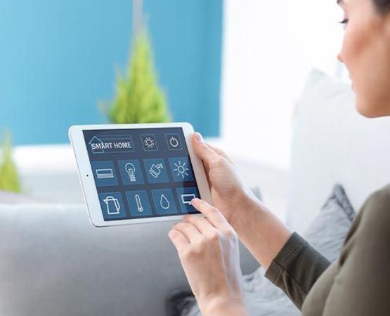 A person interacting with smart home automation system