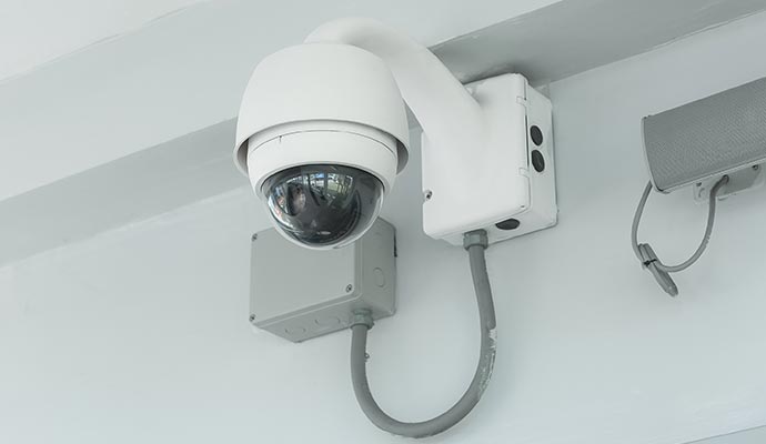 Wired security camera mounted on the wall