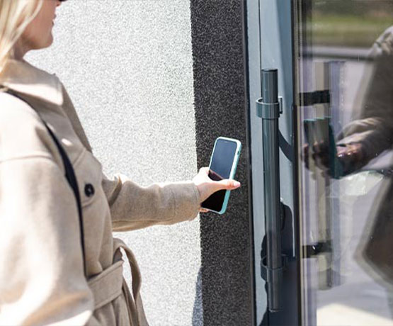 Woman using touchless access control system