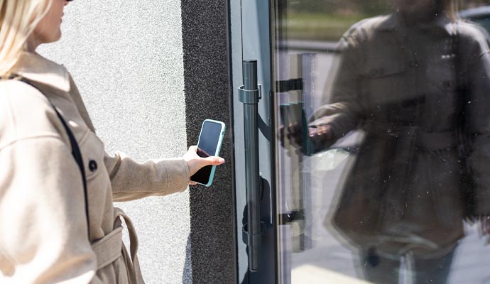 Woman using touchless access control system